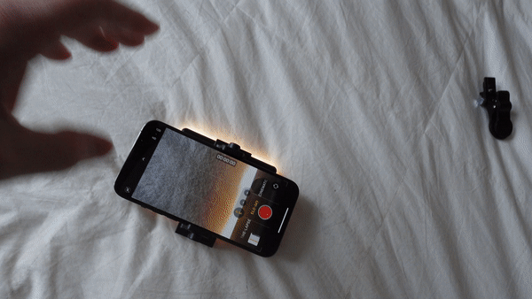 video showing ez selfie light attached and lit to rear of iphone
